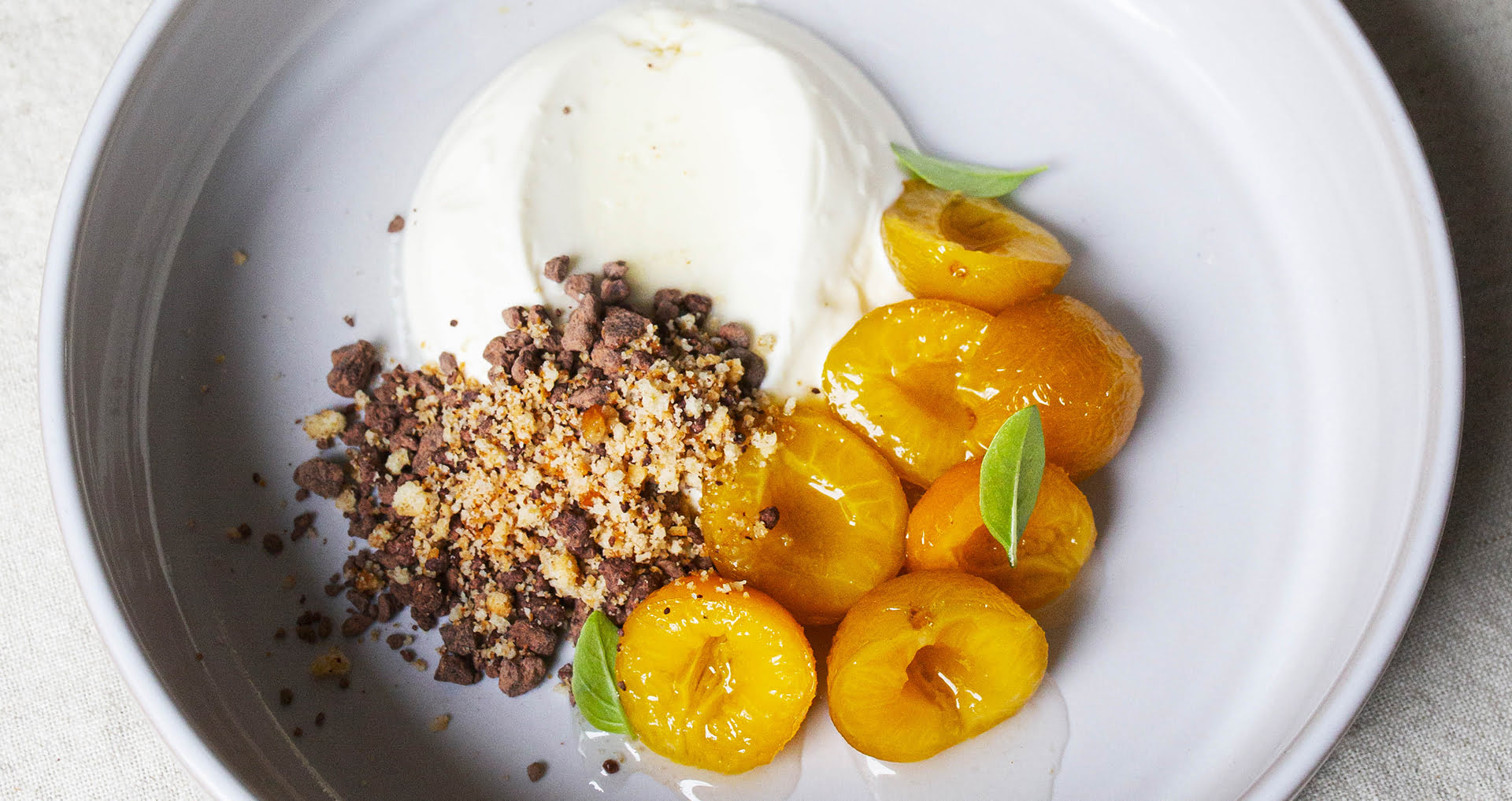 Cherry plums with cream and chocolate crumbles recipe banner taste explorer