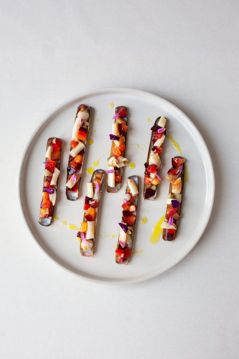 Razor clam and white nectarine focus image