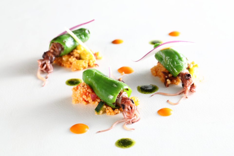 Padron peppers stuffed with hotaru squid with Chorizo Taboule and Spicy Sauce