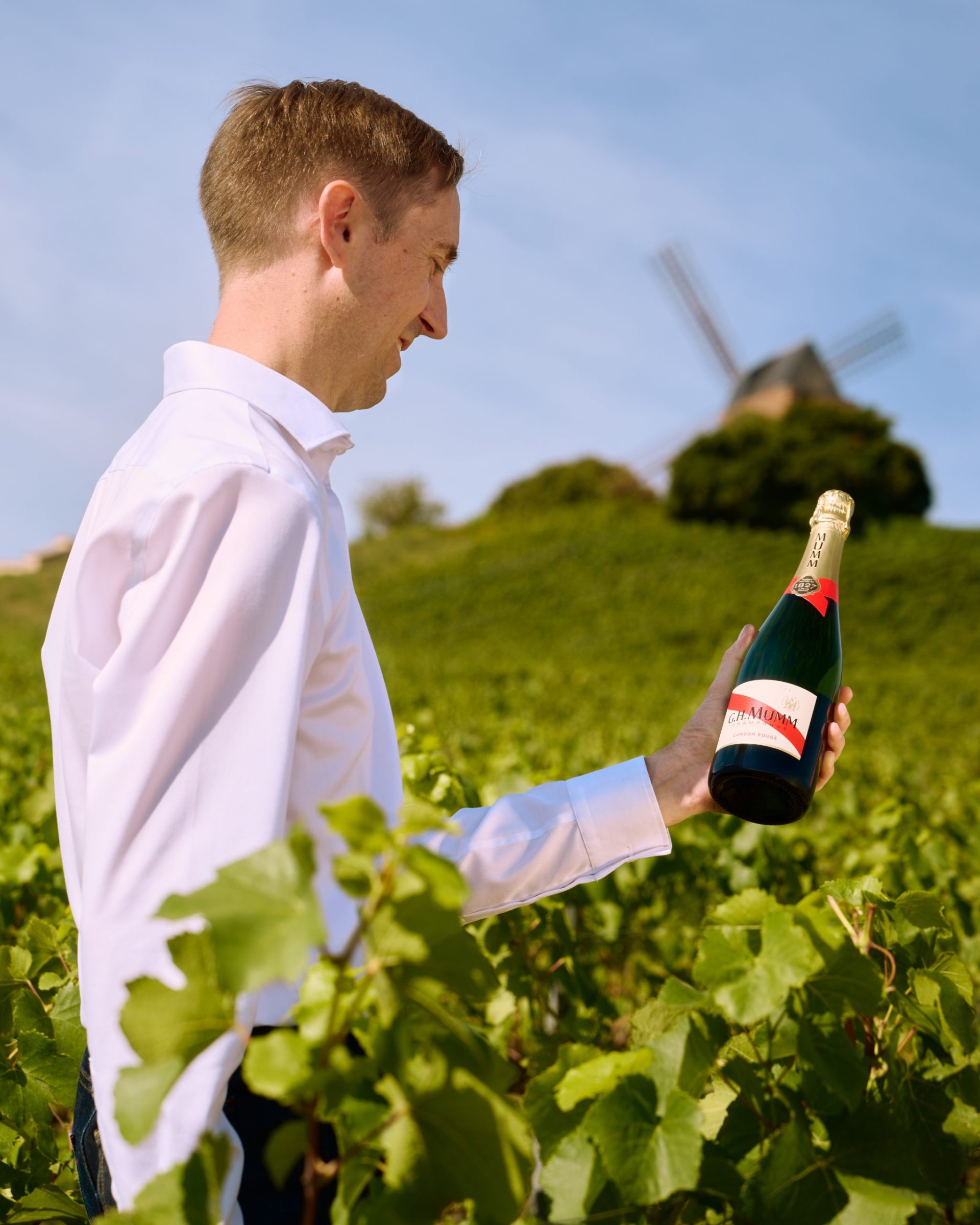 Yann close up vineyard and bottle