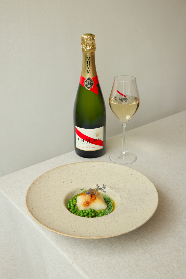 Pan-seared Cape hake, lemony morogo cream, fresh peas & spring onion oil