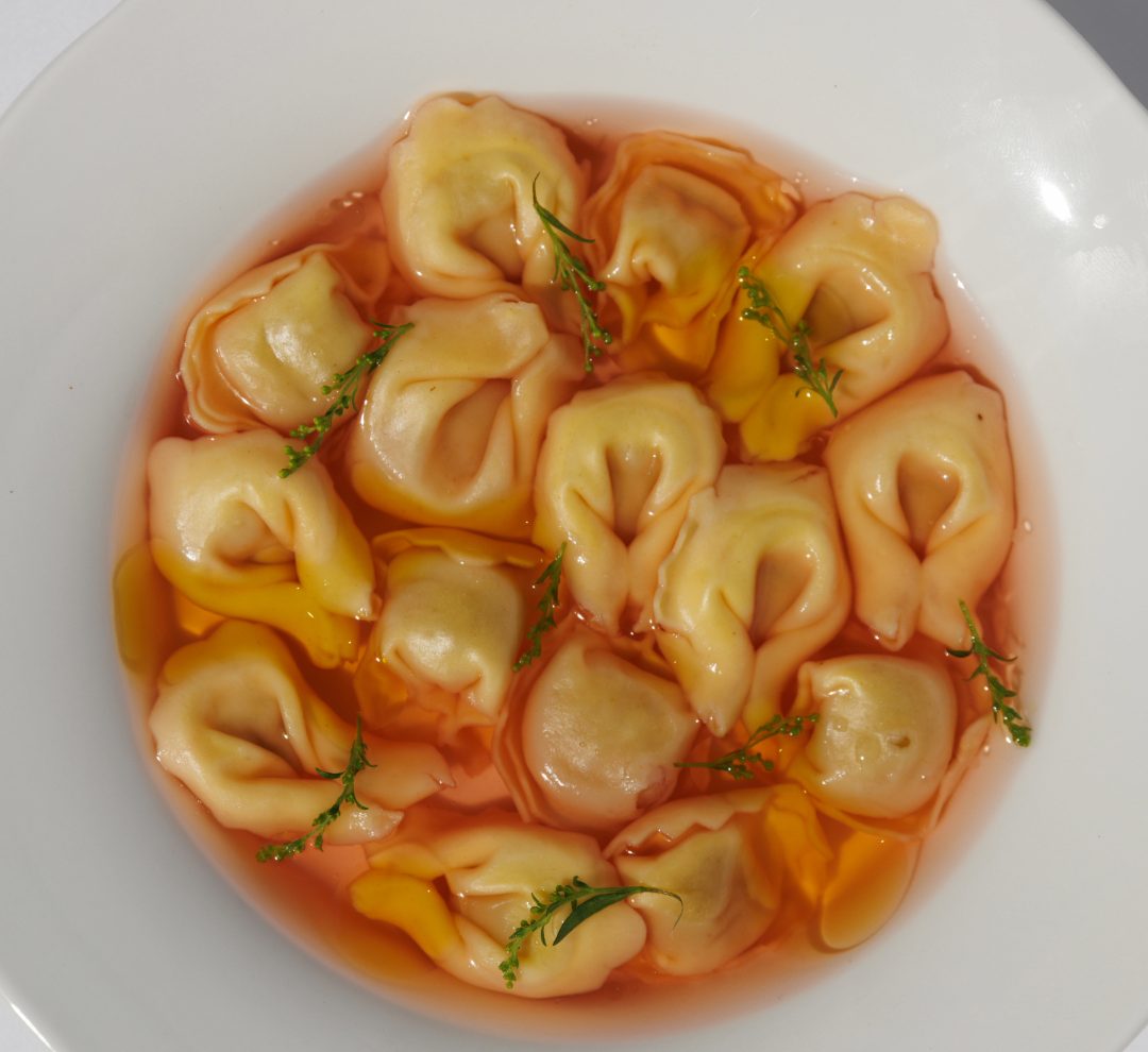 Prawn ravioli, saffron oil & sweet paprika dish paiiring Mucmm champagne